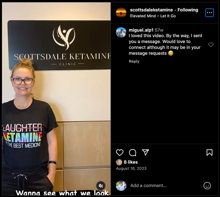 A person wearing glasses and a black T-shirt with colorful text stands in front of a wall with the Scottsdale Ketamine Clinic logo, an expert resource in ketamine therapy. The Instagram post, buzzing with comments and likes, highlights their innovative approach to wellness. - Ketamine